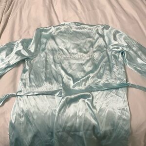 Teal women’s size large robe. “Bridesmaid” embroidered on the back.